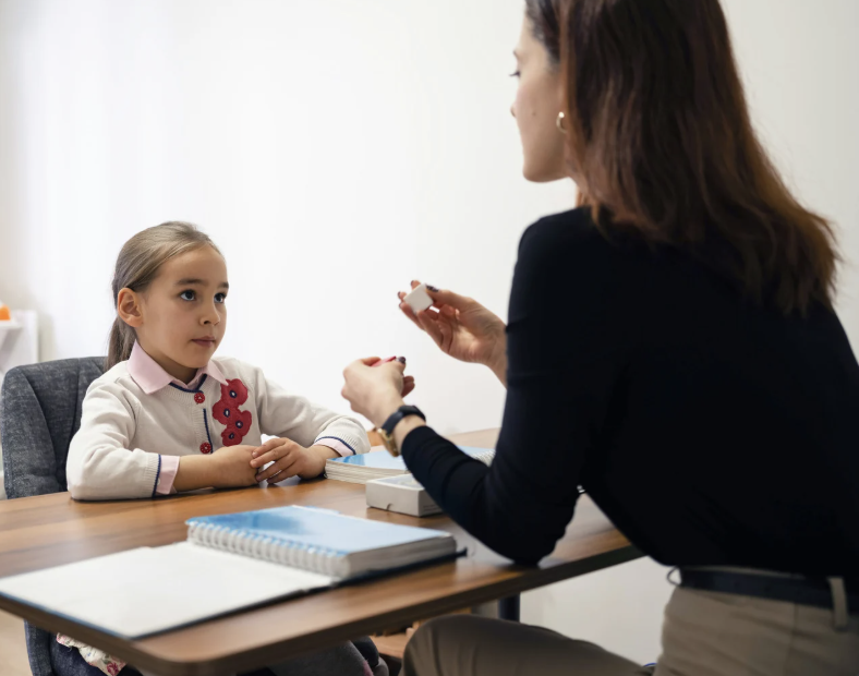 Clinician working with a student during assessment